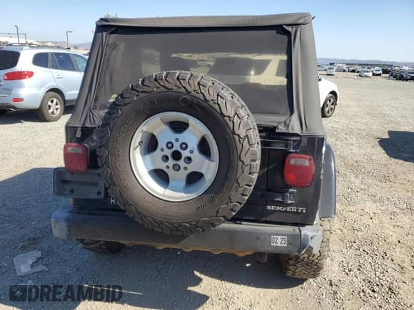 2001 Jeep Wrangler Sahara с VIN 1J4FA59S31P372167, выставлен на аукционе Copart как лот 65828905 с пробегом 170 902 миль миль и Списание • Salvage title. История ставок и продаж доступна на DreamBid. Изображение 6.