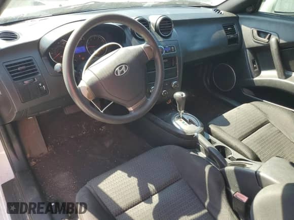 2007 Hyundai Tiburon GS с VIN KMHHM66D67U248918, выставлен на аукционе Copart как лот 77618184 с пробегом 145 703 миль миль и Списание • Salvage title. История ставок и продаж доступна на DreamBid. Изображение 8.