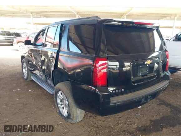 2015 Chevrolet Tahoe LS with VIN 1GNSCAKC0FR711917, listed as a IAAI auction lot 43241350 with 181,124 mi miles and . Bid and sale history available at DreamBid. Image 3.