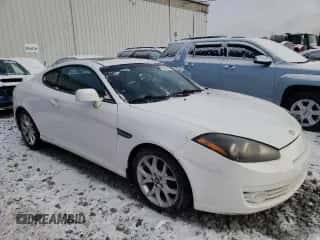 2008 Hyundai Tiburon GT с VIN KMHHN66F68U269896, выставлен на аукционе Copart как лот 87502765 с пробегом 196 437 миль миль и Списание • Salvage title. История ставок и продаж доступна на DreamBid. Изображение 4.