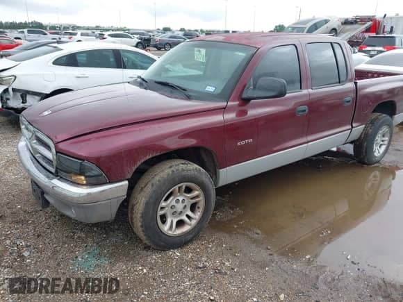 2001 Dodge Dakota Sport with VIN 1B7HL2AN11S318912, listed as a IAAI auction lot 42101199 with 128,006 mi miles and . Bid and sale history available at DreamBid. Image 2.