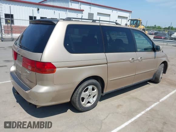 2000 Honda Odyssey EX with VIN 2HKRL1868YH001859, listed as a IAAI auction lot 42165724 with 209,393 mi miles and . Bid and sale history available at DreamBid. Image 4.