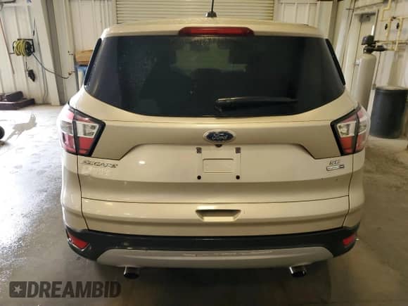 2017 Ford Escape SE с VIN 1FMCU9GD7HUE73439, выставлен на аукционе Copart как лот 81033735 с пробегом 179 814 миль миль и Чистый • Clean title. История ставок и продаж доступна на DreamBid. Изображение 6.