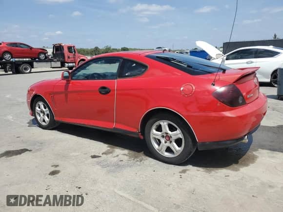 2003 Hyundai Tiburon GT с VIN KMHHN65F33U088538, выставлен на аукционе Copart как лот 54320955 с пробегом 220 732 миль миль и Списание • Salvage title. История ставок и продаж доступна на DreamBid. Изображение 2.