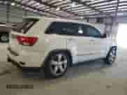 2012 Jeep Grand Cherokee Overland Summit z VIN 1C4RJFCT6CC297694, wystawiony jako Copart lot #86278345 z przebiegiem 128 814 mil mil oraz Szkoda całkowita • Salvage title. Historia ofert i sprzedaży dostępna na DreamBid. Obrazek 3.