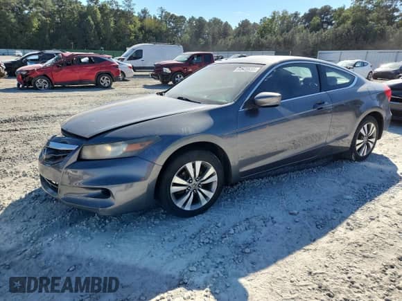 2012 Honda Accord LX-S with VIN 1HGCS1B37CA001036, listed as a Copart auction lot 84878635 with 216,596 mi miles and Clean title. Bid and sale history available at DreamBid. Image 1.