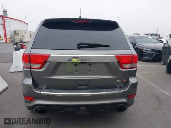 2012 Jeep Grand Cherokee SRT-8 z VIN 1C4RJFDJ8CC112350, wystawiony jako IAAI lot #42995991 z przebiegiem 210 738 mil mil oraz . Historia ofert i sprzedaży dostępna na DreamBid. Obrazek 17.