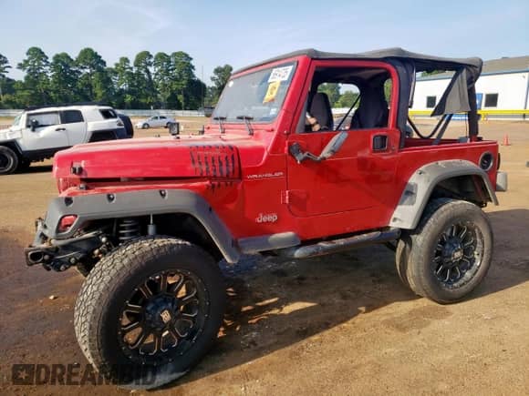 2000 Jeep Wrangler SE with VIN 1J4FA29P6YP703375, listed as a Copart auction lot 66914735 with 174,624 mi miles and Salvage title. Bid and sale history available at DreamBid. Image 1.