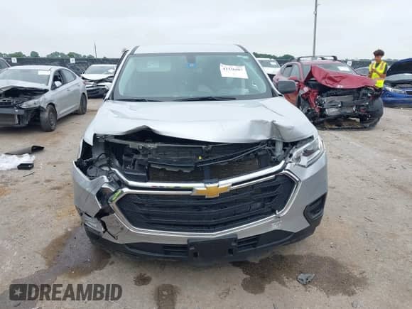2021 Chevrolet Traverse LS z VIN 1GNERFKW1MJ254095, wystawiony jako IAAI lot #42336687 z przebiegiem Nie podano mil oraz . Historia ofert i sprzedaży dostępna na DreamBid. Obrazek 6.
