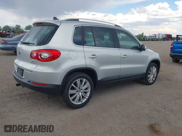 2011 Volkswagen Tiguan S with VIN WVGBV7AXXBW560022, listed as a IAAI auction lot 42693212 with 127,879 mi miles and . Bid and sale history available at DreamBid. Image 4.