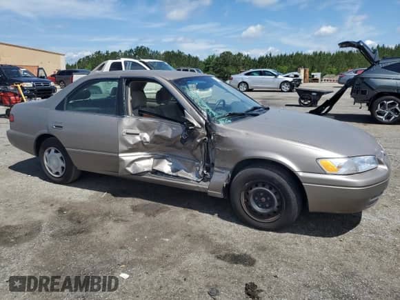1999 Toyota Camry LE with VIN 4T1BG22K7XU580604, listed as a Copart auction lot 56853285 with 279,652 mi miles and Salvage title. Bid and sale history available at DreamBid. Image 4.
