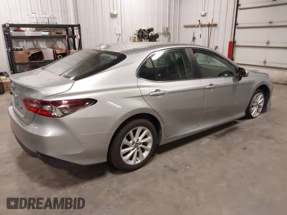2022 Toyota Camry LE with VIN 4T1C11AK2NU052242, listed as a IAAI auction lot 42943151 with 213,562 mi miles and . Bid and sale history available at DreamBid. Image 4.