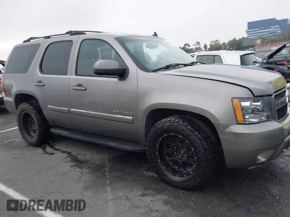 2007 Chevrolet Tahoe LTZ with VIN 1GNFC13J27R106409, listed as a IAAI auction lot 42605179 with 194,111 mi miles and . Bid and sale history available at DreamBid. Image 13.