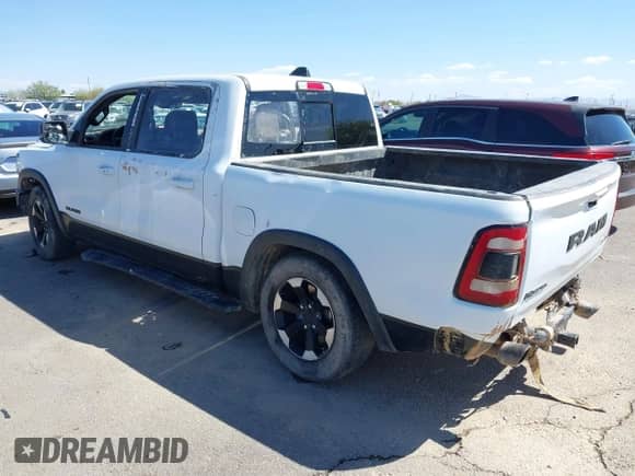 2022 Ram 1500 Rebel z VIN 1C6SRFLT4NN357352, wystawiony jako IAAI lot #41881613 z przebiegiem 31 285 mil mil oraz . Historia ofert i sprzedaży dostępna na DreamBid. Obrazek 3.