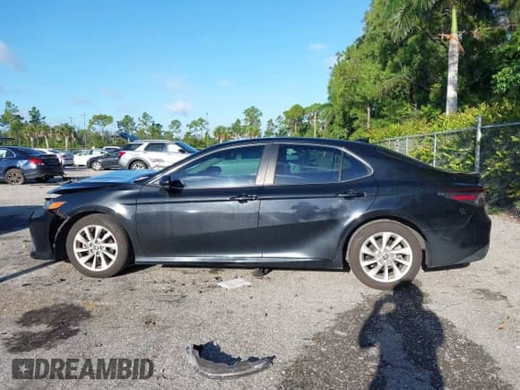 2021 Toyota Camry LE with VIN 4T1C11AK2MU472694, listed as a IAAI auction lot 43340745 with 61,965 mi miles and . Bid and sale history available at DreamBid. Image 14.