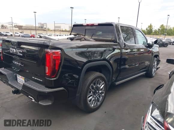 2024 GMC Sierra 1500 Denali Ultimate with VIN 1GTUUHEL6RZ384138, listed as a IAAI auction lot 43111543 with 27,138 mi miles and . Bid and sale history available at DreamBid. Image 4.