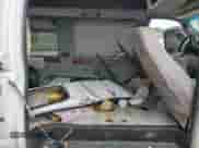 1998 Ford Econoline Cargo Recreational z VIN 1FDRE14L3WHB45879, wystawiony jako Copart lot #66877915 z przebiegiem 126 998 mil mil oraz Szkoda całkowita • Salvage title. Historia ofert i sprzedaży dostępna na DreamBid. Obrazek 10.