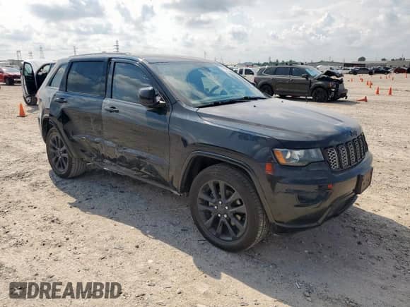 2019 Jeep Grand Cherokee Laredo E with VIN 1C4RJEAG7KC621363, listed as a Copart auction lot 70555755 with 167,551 mi miles and Salvage title. Bid and sale history available at DreamBid. Image 4.