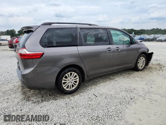 2016 Toyota Sienna XLE with VIN 5TDYK3DC1GS717940, listed as a Copart auction lot 70816645 with 125,184 mi miles and Salvage title. Bid and sale history available at DreamBid. Image 3.