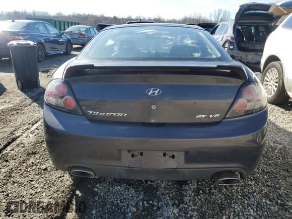 2008 Hyundai Tiburon GT с VIN KMHHN66F48U283697, выставлен на аукционе Copart как лот 85355614 с пробегом 220 427 миль миль и Списание • Salvage title. История ставок и продаж доступна на DreamBid. Изображение 6.