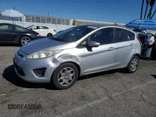 2012 Ford Fiesta SE with VIN 3FADP4EJ2CM118449, listed as a Copart auction lot 86500605 with 156,023 mi miles and Salvage title. Bid and sale history available at DreamBid. Image 1.