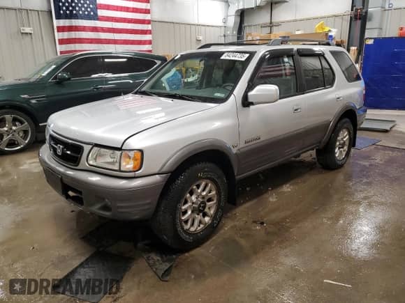 2001 Honda Passport LX with VIN 4S6DM58W814406889, listed as a Copart auction lot 84244735 with 158,711 mi miles and Clean title. Bid and sale history available at DreamBid. Image 1.