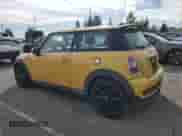 2009 MINI Hardtop S with VIN WMWMF73599TW87679, listed as a Copart auction lot 46863725 with 102,976 mi miles and Salvage title. Bid and sale history available at DreamBid. Image 2.