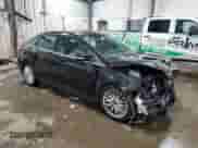 2014 Ford Focus Titanium with VIN 1FADP3J28EL169256, listed as a Copart auction lot 69953265 with 166,852 mi miles and Salvage title. Bid and sale history available at DreamBid. Image 4.