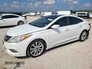 2014 Hyundai Azera Limited с VIN KMHFH4JG3EA362147, выставлен на аукционе Copart как лот 81316465 с пробегом 144 092 миль миль и Списание • Salvage title. История ставок и продаж доступна на DreamBid. Изображение 1.