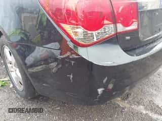 2013 Chevrolet Cruze 1LT z VIN 1G1PC5SBXD7109038, wystawiony jako IAAI lot #43413290 z przebiegiem 105 515 mil mil oraz . Historia ofert i sprzedaży dostępna na DreamBid. Obrazek 6.