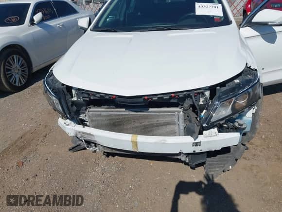 2016 Chevrolet Impala LT with VIN 2G1105SAXG9204577, listed as a IAAI auction lot 43327701 with 113,239 mi miles and . Bid and sale history available at DreamBid. Image 6.