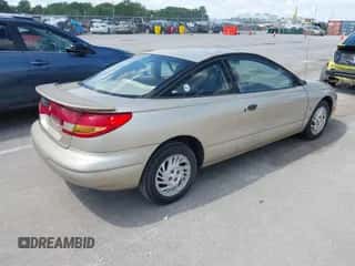 1999 Saturn SC с VIN 1G8ZP1288XZ370091, выставлен на аукционе IAAI как лот 42313045 с пробегом 126 614 миль миль и . История ставок и продаж доступна на DreamBid. Изображение 4.