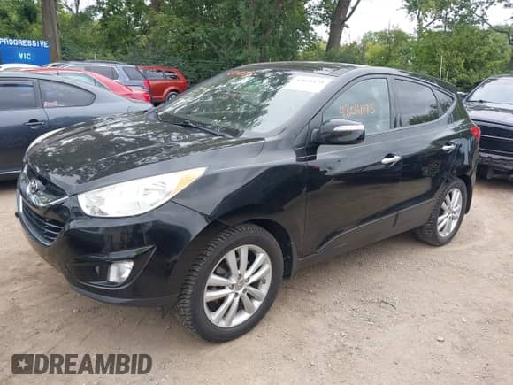 2012 Hyundai Tucson GLS with VIN KM8JU3ACXCU519889, listed as a IAAI auction lot 43041175 with 157,398 mi miles and . Bid and sale history available at DreamBid. Image 2.