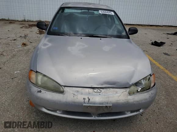 1997 Hyundai Elantra z VIN KMHJF24M9VU540731, wystawiony jako Copart lot #63684645 z przebiegiem Nie podano mil oraz Szkoda całkowita • Salvage title. Historia ofert i sprzedaży dostępna na DreamBid. Obrazek 5.