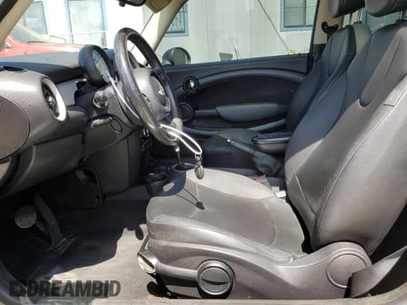 2013 MINI Hardtop with VIN WMWSU3C52DT680782, listed as a Copart auction lot 61779515 with 94,378 mi miles and Salvage title. Bid and sale history available at DreamBid. Image 7.