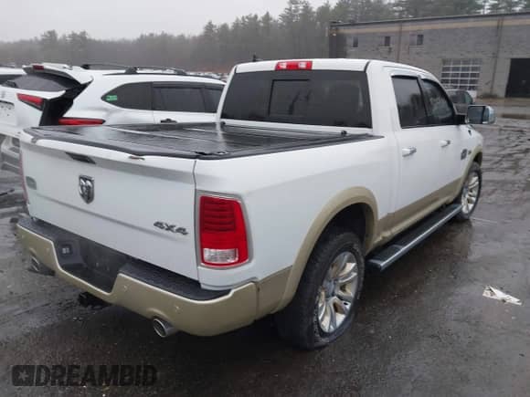 2015 Ram 1500 Laramie Longhorn with VIN 1C6RR7PT8FS545812, listed as a IAAI auction lot 41900984 with 61,493 mi miles and . Bid and sale history available at DreamBid. Image 4.