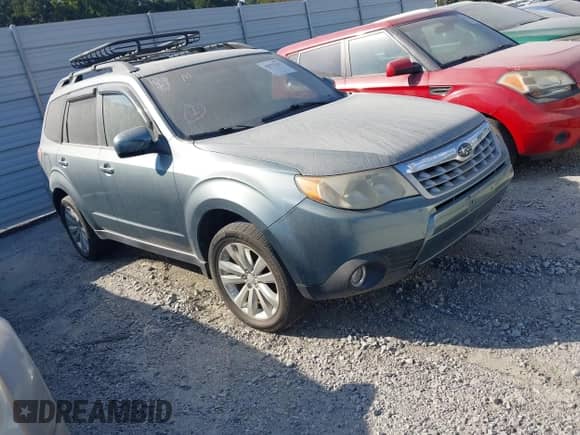 2012 Subaru Forester X Limited z VIN JF2SHBEC0CH420297, wystawiony jako IAAI lot #43180001 z przebiegiem 170 820 mil mil oraz . Historia ofert i sprzedaży dostępna na DreamBid. Obrazek 1.