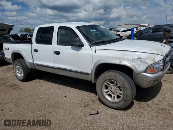 2003 Dodge Dakota SLT с VIN 1D7HG48N13S177855, выставлен на аукционе Copart как лот 62500025 с пробегом 76 678 миль миль и Списание • Salvage title. История ставок и продаж доступна на DreamBid. Изображение 4.