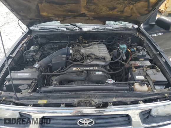 1997 Toyota Tacoma z VIN 4TAWN72N7VZ241873, wystawiony jako Copart lot #68393535 z przebiegiem 216 059 mil mil oraz Szkoda całkowita • Salvage title. Historia ofert i sprzedaży dostępna na DreamBid. Obrazek 11.