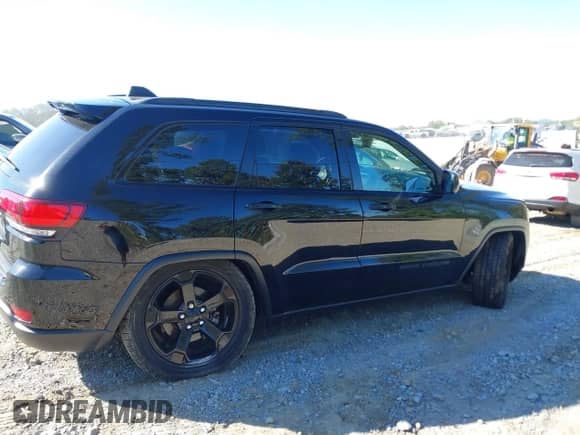 2020 Jeep Grand Cherokee Laredo E with VIN 1C4RJFAG3LC127590, listed as a IAAI auction lot 43419572 with 71,761 mi miles and . Bid and sale history available at DreamBid. Image 6.