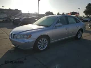 2007 Hyundai Azera SE z VIN KMHFC46F67A179939, wystawiony jako Copart lot #82668965 z przebiegiem 213 551 mil mil oraz Szkoda całkowita • Salvage title. Historia ofert i sprzedaży dostępna na DreamBid. Obrazek 1.