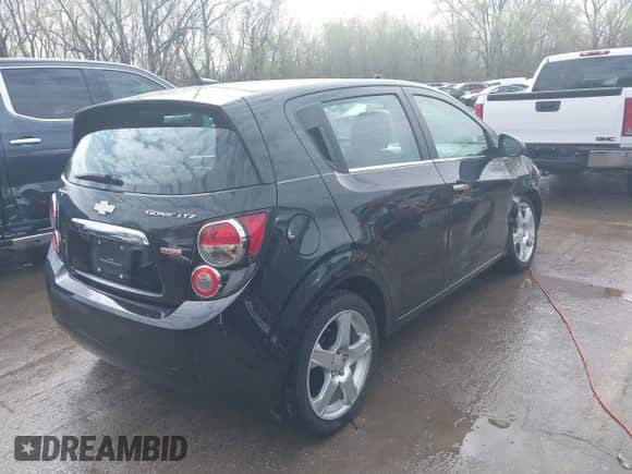 2014 Chevrolet Sonic LTZ with VIN 1G1JE6SBXE4212257, listed as a IAAI auction lot 41916104 with 71,956 mi miles and . Bid and sale history available at DreamBid. Image 4.