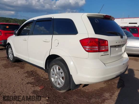 2014 Dodge Journey SE with VIN 3C4PDCABXET214038, listed as a IAAI auction lot 43390602 with 155,052 mi miles and . Bid and sale history available at DreamBid. Image 3.