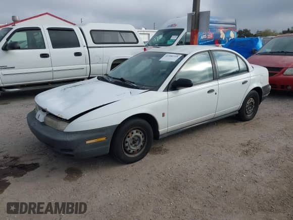 1999 Saturn SL с VIN 1G8ZH5284XZ318834, выставлен на аукционе IAAI как лот 41486518 с пробегом 178 227 миль миль и . История ставок и продаж доступна на DreamBid. Изображение 2.
