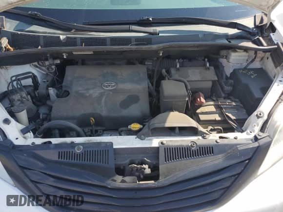 2012 Toyota Sienna with VIN 5TDZK3DC2CS184186, listed as a Copart auction lot 71013535 with 172,772 mi miles and Salvage title. Bid and sale history available at DreamBid. Image 12.