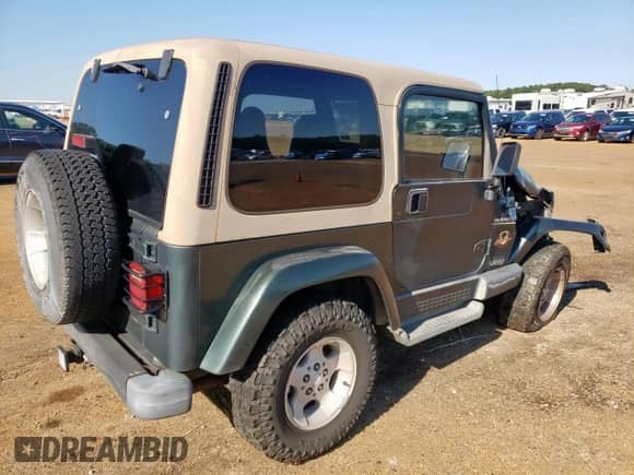 2002 Jeep Wrangler Sahara с VIN 1J4FA59S52P748031, выставлен на аукционе Copart как лот 72028895 с пробегом 169 546 миль миль и Списание • Salvage title. История ставок и продаж доступна на DreamBid. Изображение 3.