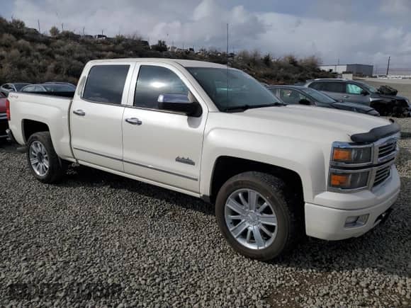 2014 Chevrolet Silverado 1500 High Country with VIN 3GCUKTEJ0EG431584, listed as a Copart auction lot 49073475 with 212,354 mi miles and Salvage title. Bid and sale history available at DreamBid. Image 4.