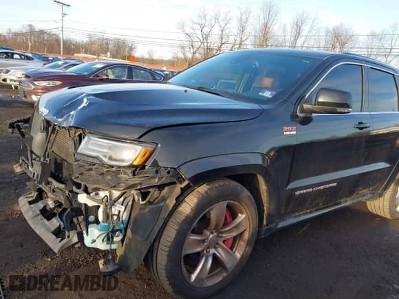 2015 Jeep Grand Cherokee SRT with VIN 1C4RJFDJ6FC744087, listed as a IAAI auction lot 41500653 with 130,530 mi miles and . Bid and sale history available at DreamBid. Image 6.