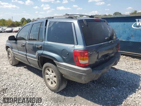2001 Jeep Grand Cherokee Laredo с VIN 1J4GW48S21C693190, выставлен на аукционе Copart как лот 80888225 с пробегом 428 569 миль миль и Списание • Salvage title. История ставок и продаж доступна на DreamBid. Изображение 2.