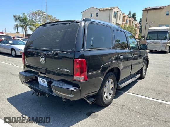 2002 Cadillac Escalade with VIN 1GYEC63T22R113253, listed as a Copart auction lot 56408115 with 249,604 mi miles and Salvage title. Bid and sale history available at DreamBid. Image 4.